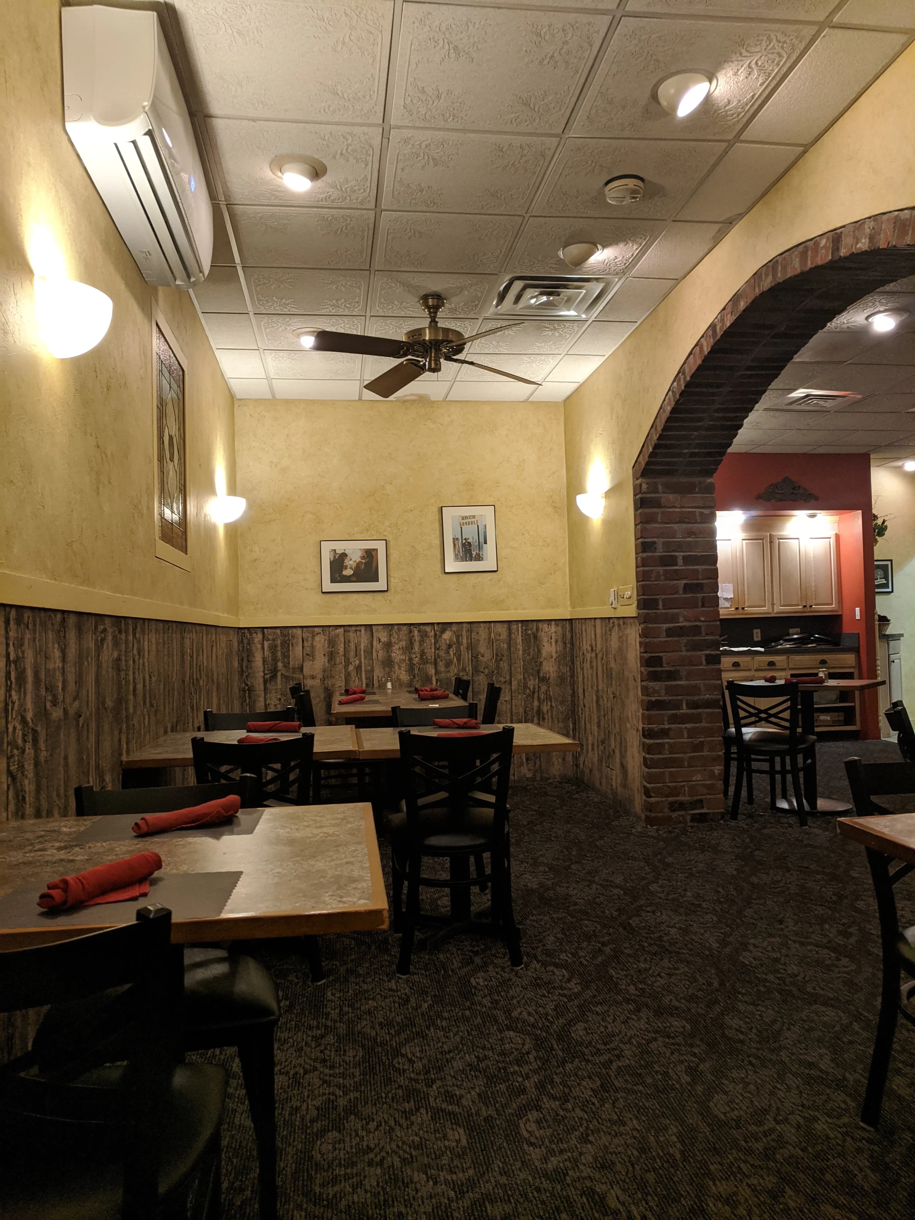 Banquet room with brick archways and table seating