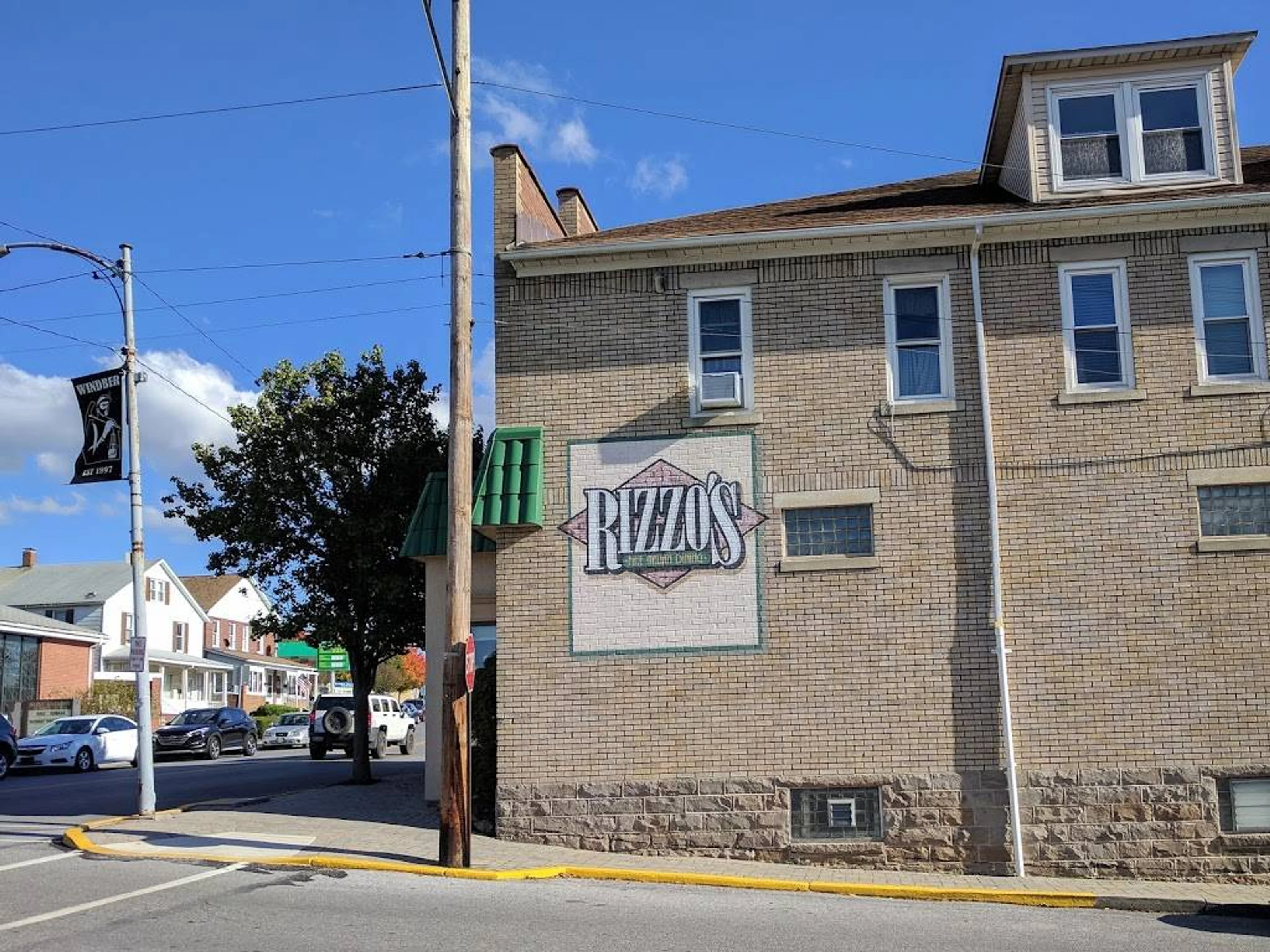 Exterior wall mural and building facade at Rizzo's