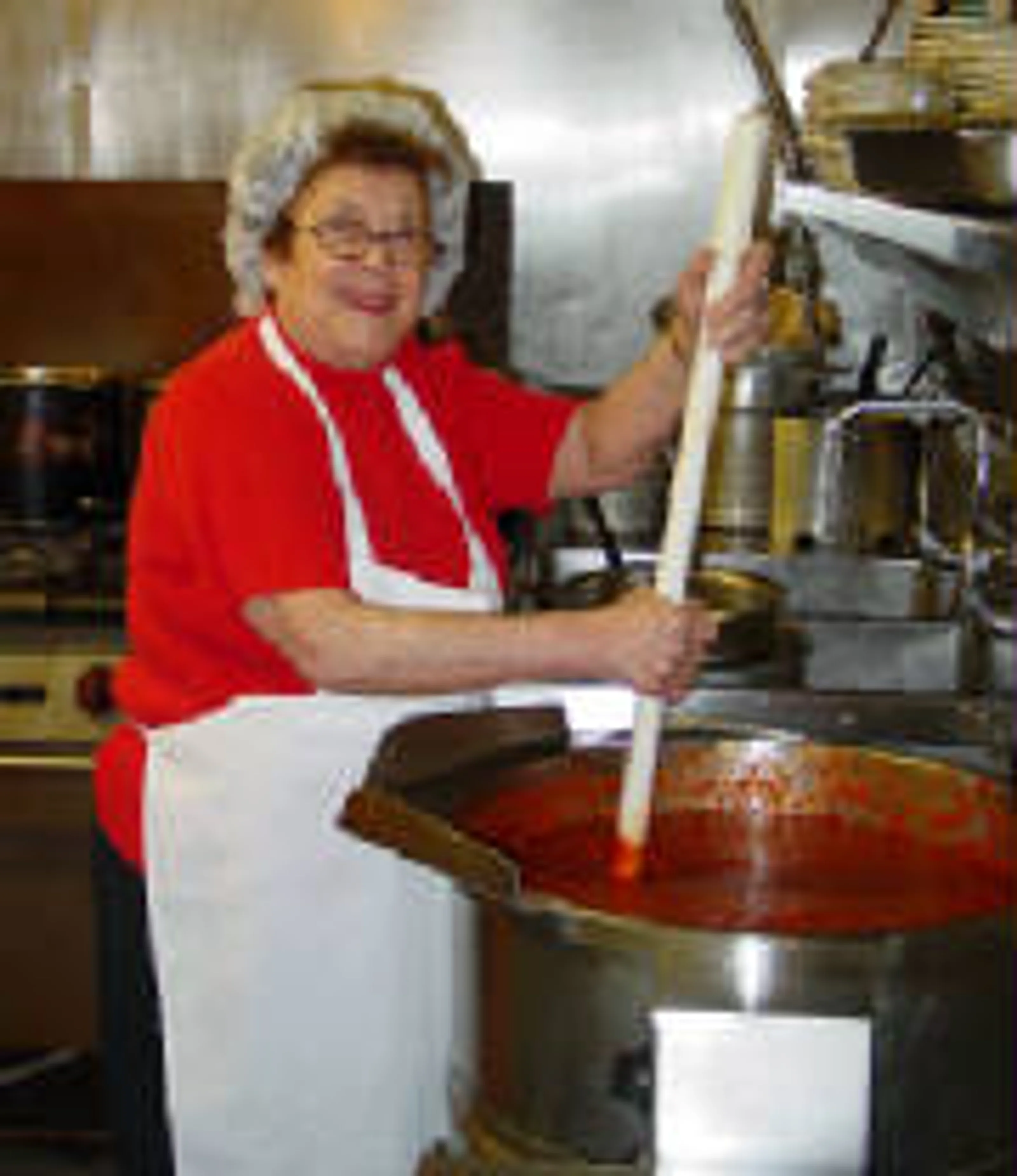 Millie preparing sauce in the kitchen